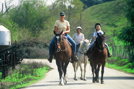 Photo of horseback riders strolling along English Road 